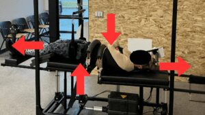 Patient receiving RoboTrac 3D spinal traction for anterolisthesis treatment and lower back instability correction in Kelowna