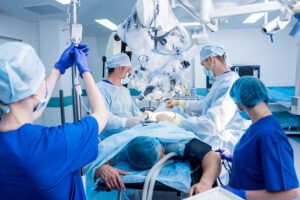 Spinal surgery team in an operating room, representing why patients may explore conservative scoliosis treatment options before surgery.