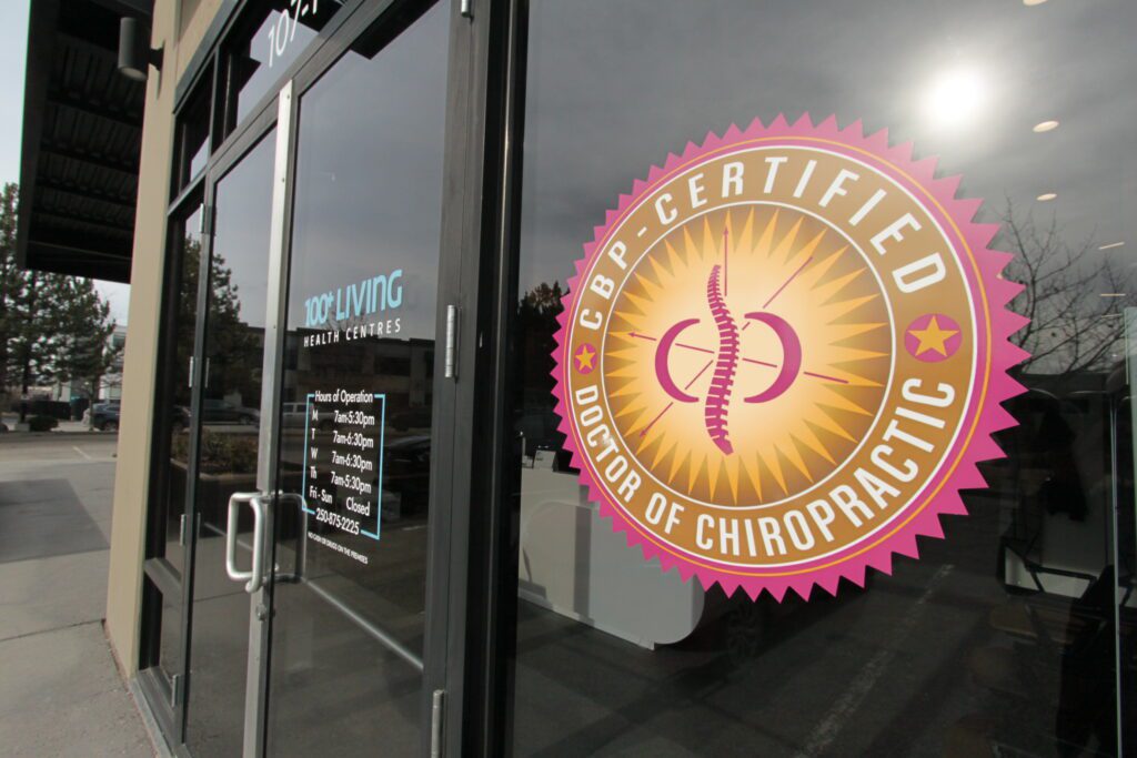 CBP Certified Doctor of Chiropractic logo displayed on the glass entrance door of a health clinic